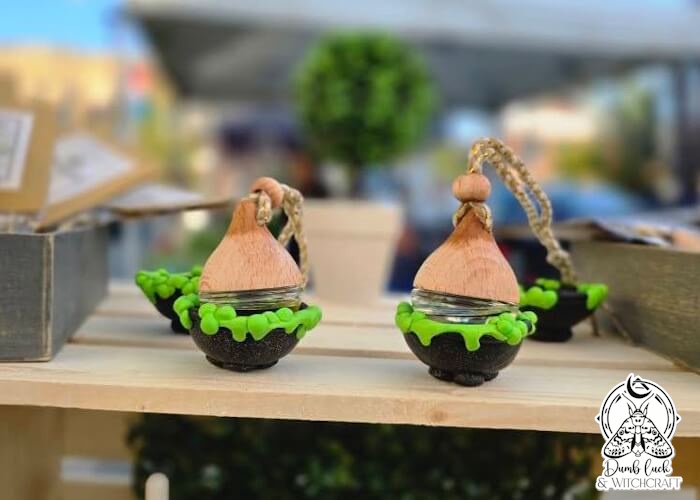 Dumb Luck & Witchcraft market booth with candles and art prints